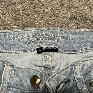 American Eagle light wash ripped low rise skinny jeans